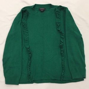 Liz Claiborne’s rich green sweater with ruffles